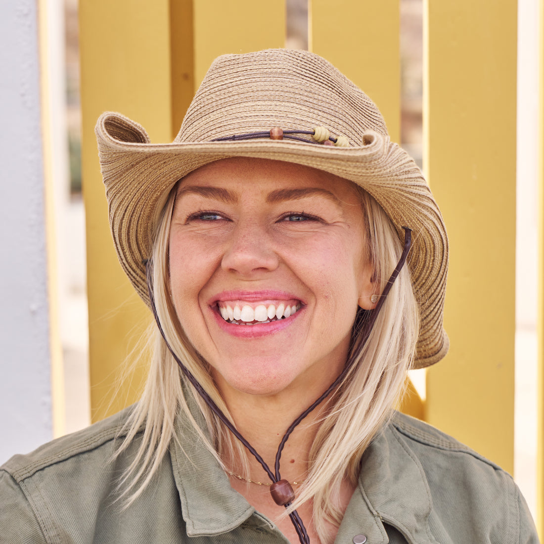 Woman wearing a Sunday Afternoons Sunset Hat.
